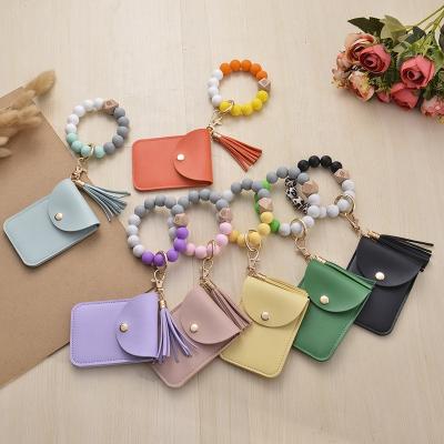 China New Eco-friendly Silicone Bead Chain Bead Key Card Case Key Bracelet Ring ID Card Holder Wood Bracelet for sale