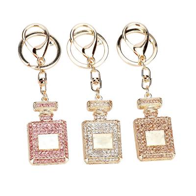 China Promotional Souvenir 2022 New Arrivals Gift Perfume Bottle Key Chain Creative Crystal Rhinestone Keychain Ring Women Bag Charm for sale