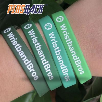 China Custom vintage logo silicone wristband, rubber wrist bands for apparel, hat branding, hangbag logo customized silicone wristband for sale