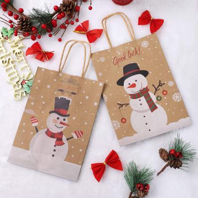 China Recyclable Merry Christmas Snowman Custom Printed Kraft Paper Bag Small Handbags For Christmas for sale