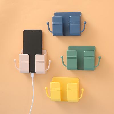 China Creative Multi-Functional Cable Punch-free Creative Hanging Hanger Shelf Storage Bedside Wall Mobile Phone Holder Fixed Hanger for sale