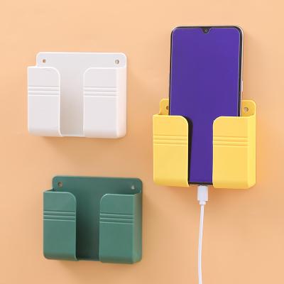 China Creative Multi-Functional Cable Punch-free Creative Hanging Hanger Shelf Storage Bedside Wall Mobile Phone Holder Fixed Hanger for sale