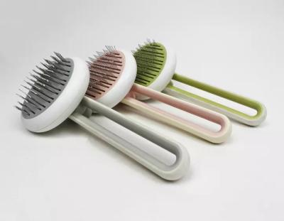 China Sustainable Pet Grooming Brush Self Cleaning Dog Pet Hair Remover Cat Comb With Massaging Bead On Tips zu verkaufen