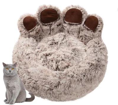 China Amazon Hot Sale Nigh Quality Pet Winter Soft Heating Warm Plush Bed Round Small Pet Bed For Dog Cat for sale