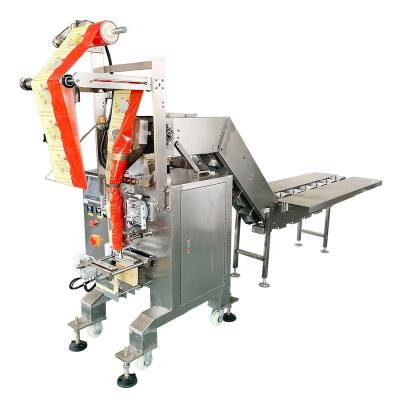 China Food Hydraulic String Halal Semi Automatic Packaging Machine, Semi Automatic Long Beard Candy Packing Machine in Indonesia for sale