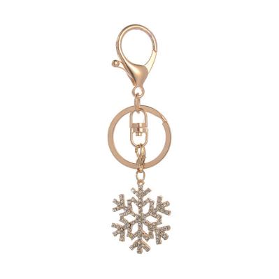 China Popular Rhinestone Metal Snowflake Fashion Ornament Christmas Gift Key Chain Key Chain With Lobster Clasp for sale