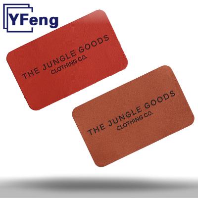 China Manufacturer Brand LOGO Heat transfer jeans clothing printing washable laser emboss Deboss tag patch genuine leather label for sale