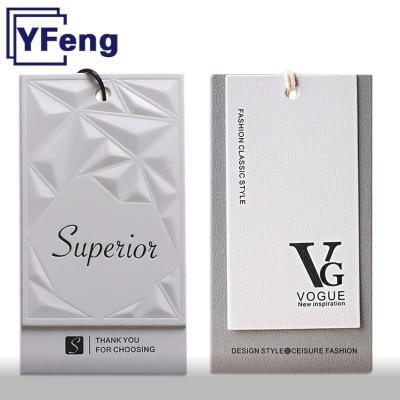 China Sustainable Recycled Brand LOGO Emboss Printing Clothing Garment Gift Card Kraft Paper Cardboard Swing Hang Tag With String for sale