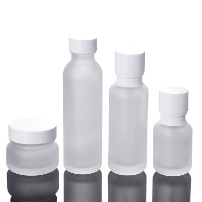 China Household Products Wholesale New Design Glass Lotion Bottle With Pump Frosted Cap Spray Bottle Plastic Cream Box Packaging for sale