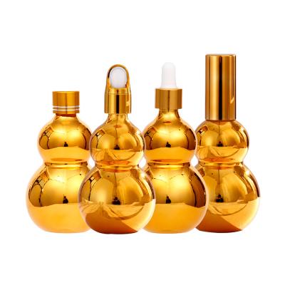 China High Qiality Shiny Electroplate Gold Squash Bottle Essential Oil Bottle Flower Basket Lid Glass Dropper Bottle for sale