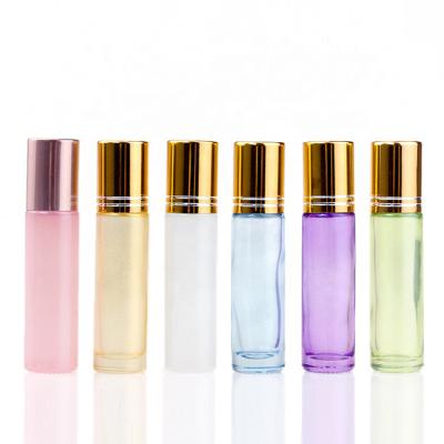 China Customized Recyclable Pearlescent Color Essential Oil Roll Ball Bottles 10ml Roll On Perfume Glass Bottle With Gold Aluminum Cap for sale