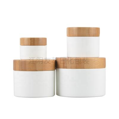 China 10g 20g 30g 50g 100g Personal Cosmetic Wood Screw Cap Plastic Skin Care Packaging Jar With Bamboo Caps for sale