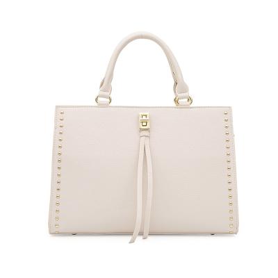 China Fashion Fashion Tassel Rivet Large Women Bags 2021 Woman Bags Luxury Handbags for sale