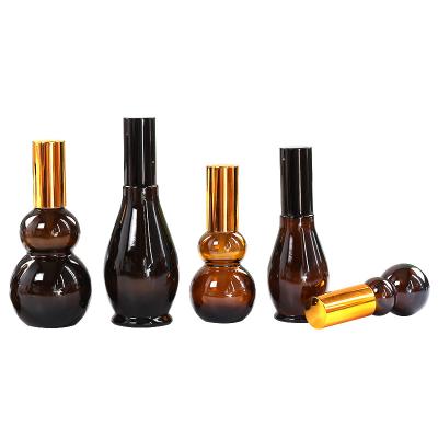 China Empty Personal Care Amber Aromatherapy Liquid Brown Glass Essential Oil Dropper Bottle for sale