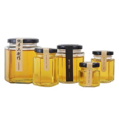 China Hot Sale Viable Clear 45ml 85ml 100ml 180ml 280ml 380ml 730ml Honey Hexagonal Glass Jar With Metal Lid for sale