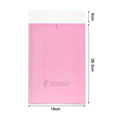 China Strong Adhesive Custom Printed Pink Eco Kraft Bubble Mailer Bag for sale