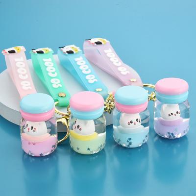 China Fashion Creative Charm Creative Cute Cartoon Floating Cat Macaron Keychain Crystal Quicksand Liquid Surfing Cat Keyring For Girls Pendant Gift for sale