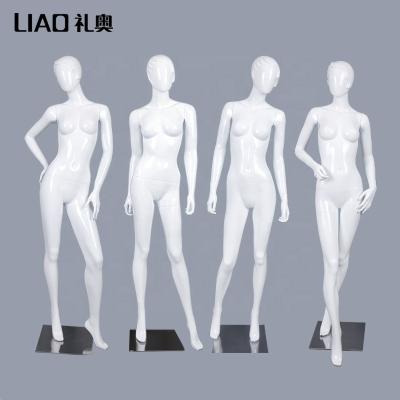 China Good Quality Female Mannequin Fashion Display Holding Faceless Abstract Head Mannequin Adult Female for sale