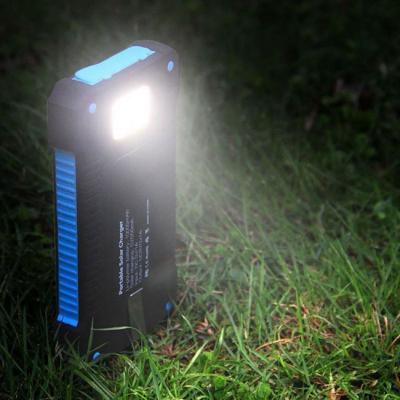 China ABS 12000mAh Polymer Battery Dual USB Waterproof Solar Power Bank with Flash light for sale