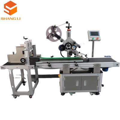 China Food Shop Paging Dispenser Suction Labelling Machine with High Accuracy from Guangdong for sale