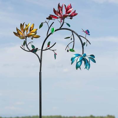 China Metal color copper wind spinner with three spinning flowers and butterflies for sale