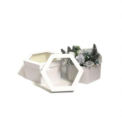 China Recycled Materials Luxury Two-Piece Window Opening Tined Cloth Hexagonal Flower Boxes Gift Packaging Box for sale