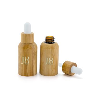 China 20ml 50ml 100ml Dropper Bottle Cosmetic Essential Oil Bamboo Glass Bottle With Bamboo Cap for sale