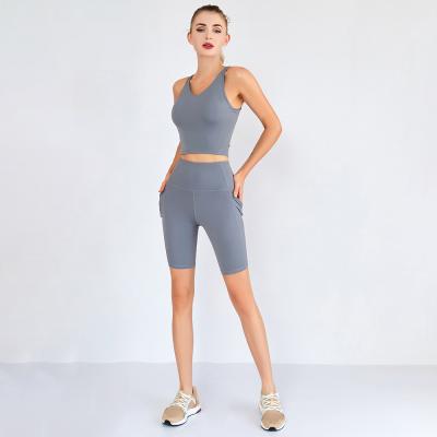 China New Breathable Two Piece Biker Shorts Sets Yoga Shorts With Pockets Sports Set Women Fitness Running Yoga Set for sale