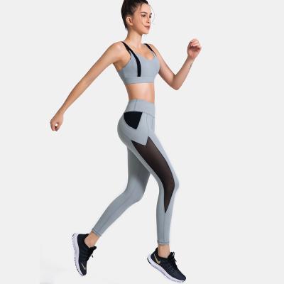 China Contrast color breathable yoga exercise apparel sports bras pants stitching sports suit yoga apparel suit for sale