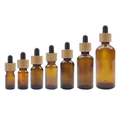 China 10Ml 15Ml 20Ml 30Ml 50Ml 100Ml Amber Glass Bottle Dropper Essential Oil Cosmetic Bottle With Aluminum Wood Cap for sale