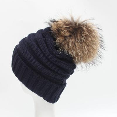 China Fashion COMMON warm trend winter young girls Christmas brimless hat rolled brim big fur ball knitted hat thick woolen warm hat for sale