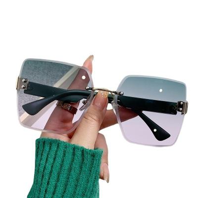 China Dropshipping Factory New Rimless Cut Rimless Women's Sunglasses Street Shoot Fashion Sunglasses Retro Pilot Dropshipping Factory New for sale