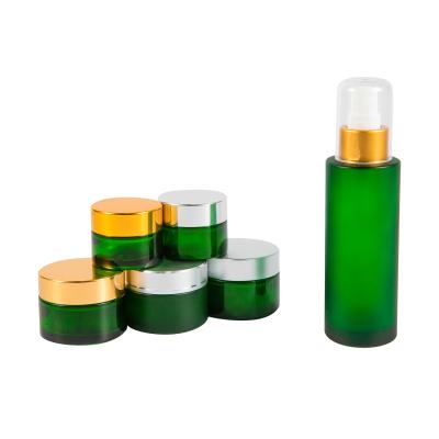 China Beauty industry 10g 20g 30g 50g green glass jar sometic jar with metal lid for sale