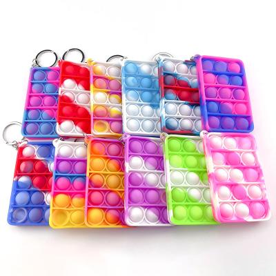 China Custom soft silicone 3d pvc key chain/soft rubber key chains/silicone pop it wiggle toy for sale