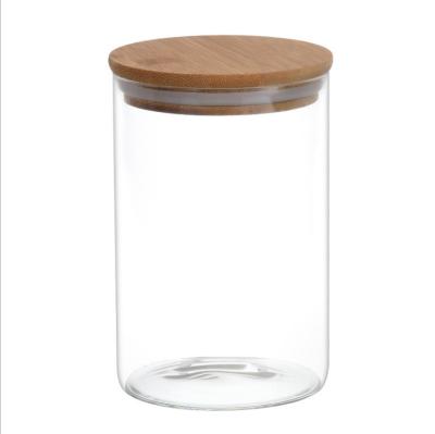 China Sustainable clear glass raw bamboo wood lid sealed jar nuts storage jar high borosilicate kitchen storage bottle cereal for sale