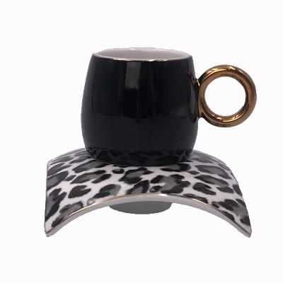 China 100cc Unique Viable Decal Shape Black Arabic GlazeTea Coffee Cup And Saucer Set With Gold Handle And Saucer for sale