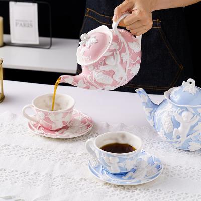 China Designer Sustainable High Quality Ins Style Embossed White Blue Ceramic Rose Teapot Teapot for sale