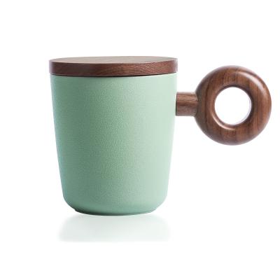 China Viable Unique Design Matt Glaze Tea Coffee Ceramic Mug Cup With Solid Wood Lid And Handle for sale