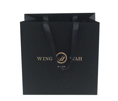 China Mini Jewelery Gift Bag With Durable Shiny Paper Handles for sale