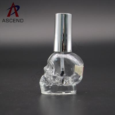 China Eco Friendly Personal Care Skull Shaped Cosmetics Nail Polish Glass Empty Bottle 14ml With Black Brush And Screw Lid for sale