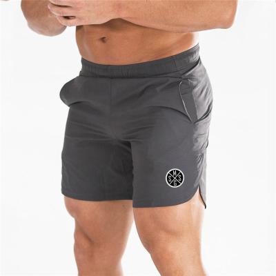 China Anti-wrinkle Summer Sports Wear Men's Mesh Shorts Gym Workout Training Sports Underpants With Pockets for sale