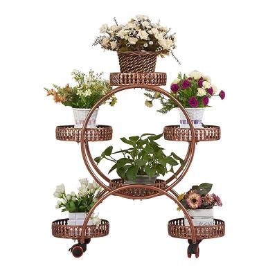 China Multi-layer (height) adjustable iron art with wheel floor green flower pot rack living room balcony flower shelf household indoor flower shelf shelv for sale