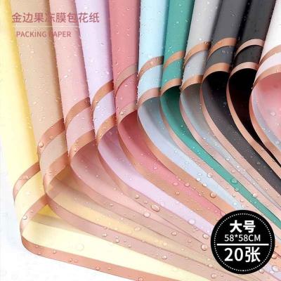 China Best Selling Wholesale Design Gold Edge Sight Waterproof Plastic Flower Wrapping Paperwaterproof Kraft Paper for sale