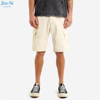 China Anti-Wrinkle Fashion Custom Summer Solid Color Shorts Loose Multi Pocket Zipper Fly Cargo Pants Beige Men for sale