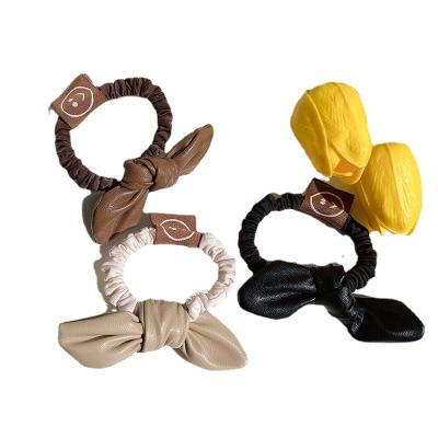 China Korea Dongdaemun Bow Smiley Face Pu Hair Rope Small Intestine Ball Single Head Korean Leather Girl Cute Elastic Band Hair Ring for sale