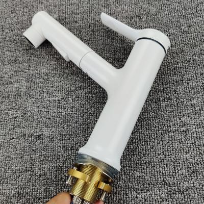 China Zinc Metered Ceramic White Body Hot And Cold Water Tap Single Handle Bathroom Sink Pull Out Basin Faucet for sale