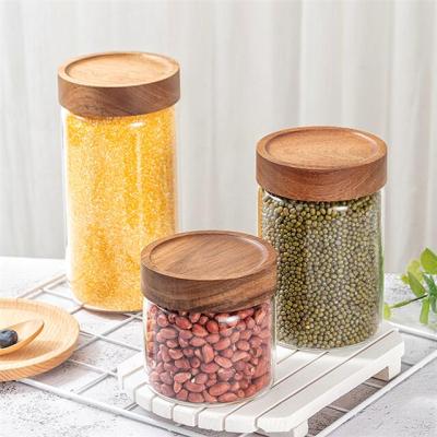 China Acacia food storage borosilicate glass jar wooden stored container with wooden lid, high quality acacia lid glass food jar for sale