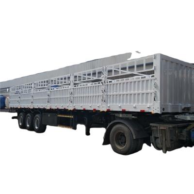 China Truck Trailer Barrier Trailer Flat Bed Truck 3 Axles New 50ton With Side Wall Low Price Semi Trailer for sale