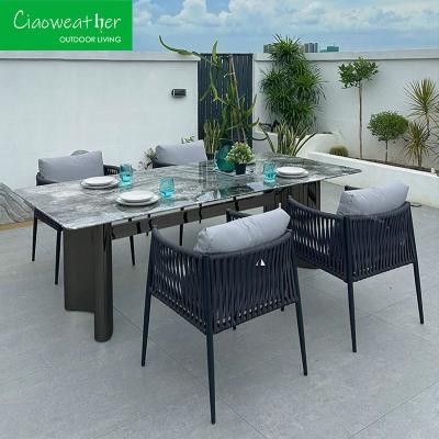 China Postverpakking Tuinmeubilair Aluminium patio Eetstoel Set met buiten Wicker Rattan Tafel en 4 stoelen Te koop