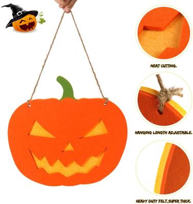 China Polyester Felt Halloween Decoration 2021 Double Layered Felt Large Pumpkin For Kids Halloween Costume Party Door Hanger for sale